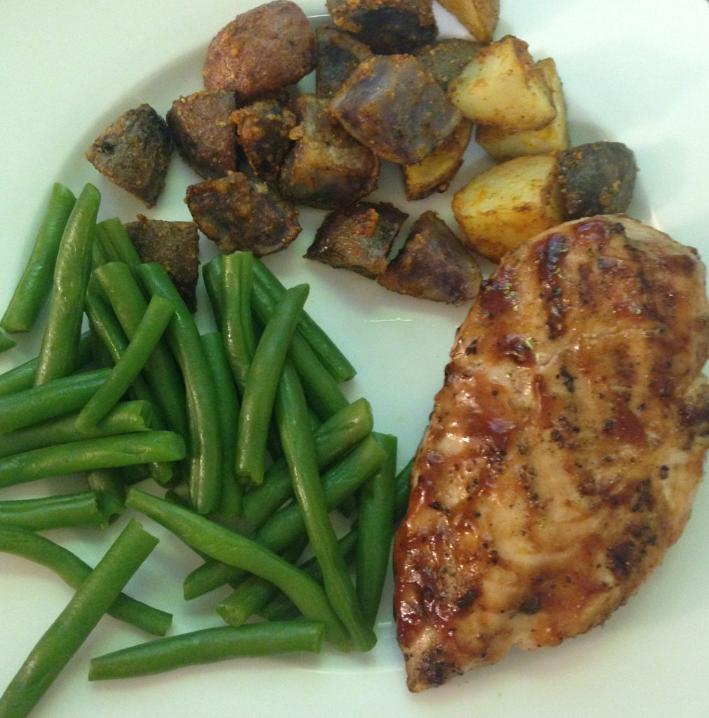 crispy parmesan potatoes, green beans, and bbq chicken for dinner