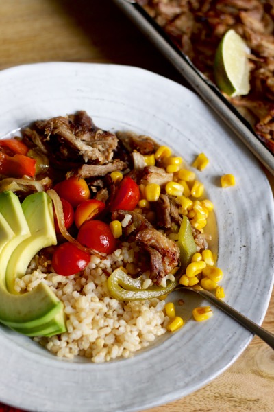 Burrito bowls made from carnitas for a crowd are the perfect way to feature the crispy pork!