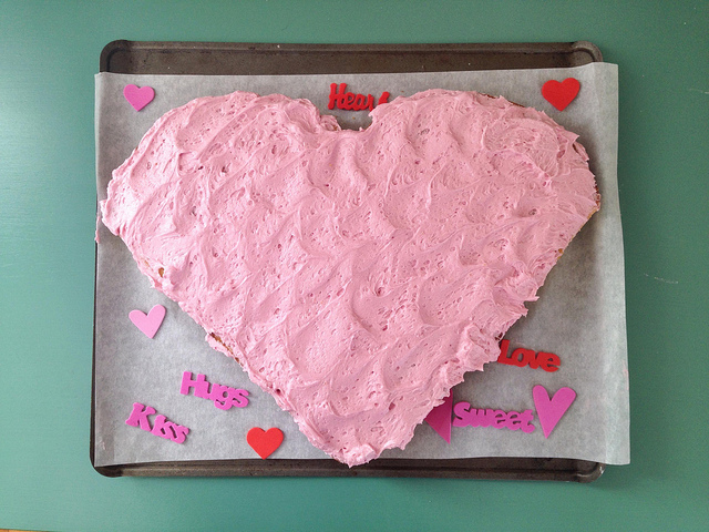 heart-shaped cake with natural, dye-free pink icing