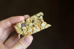 a bite of a chewy chocolate chip granola bar