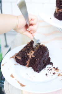 my baby sneaking a bite of chocolate cake