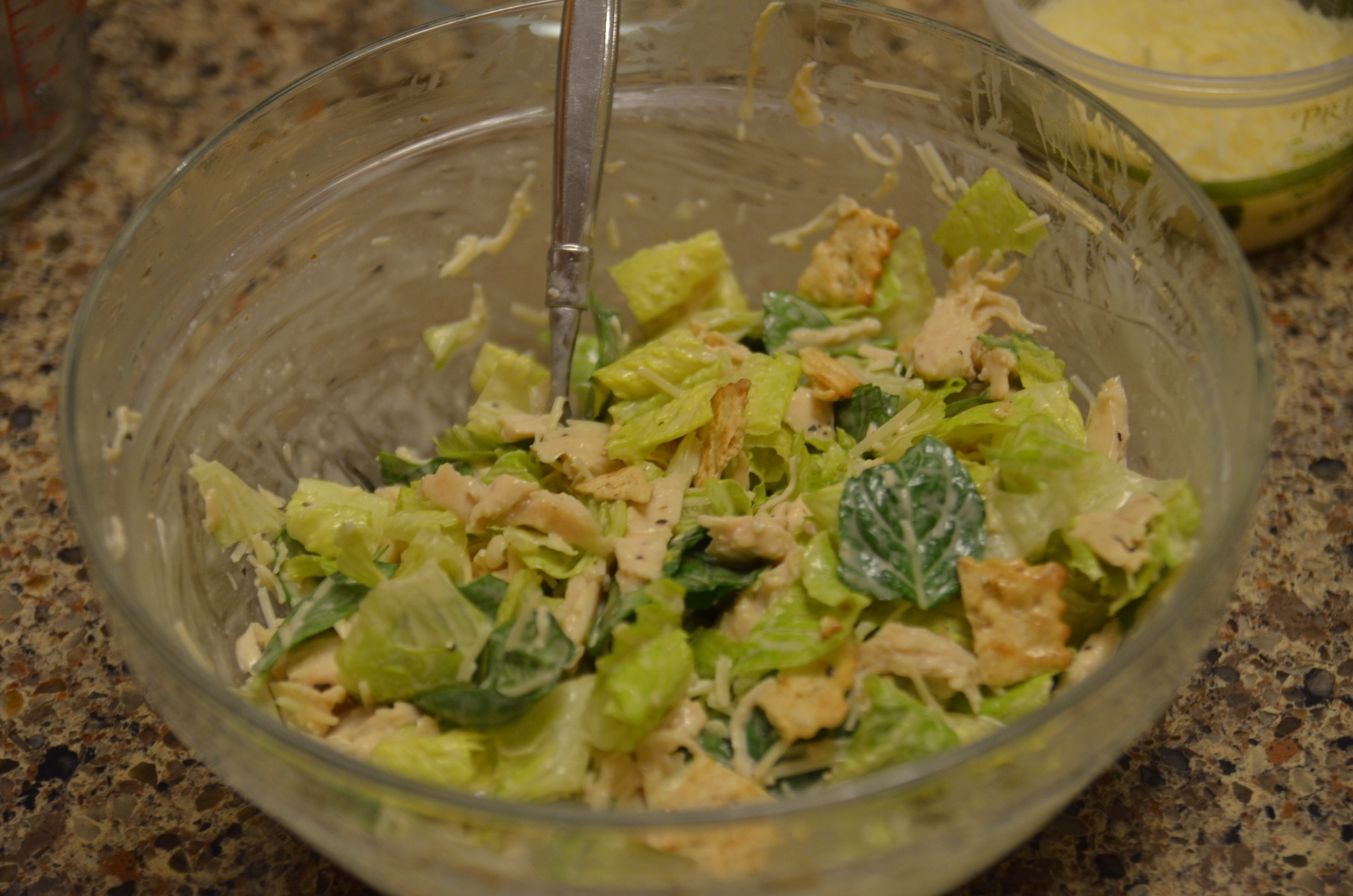 mixing the salad filling for chicken caesar wraps