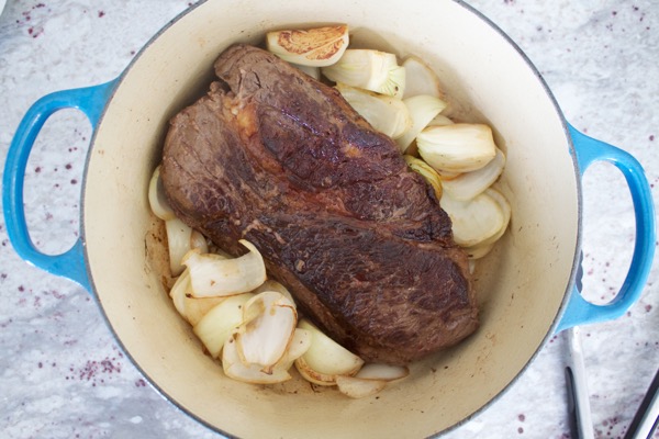 seared chuck roast and onions for pot roast