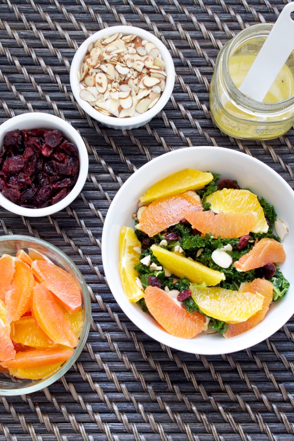 Citrus kale salad is full of delicious contrasts - tangy dressing, hearty kale, sweet juicy oranges, and crunchy almonds. It's salad heaven, and you can make prep the components ahead of time for salad all week!