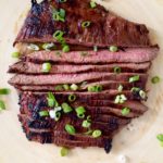 Soy sauce and honey marinated flank steak is simple, juicy, and flavorful thanks to hints of garlic and ginger.