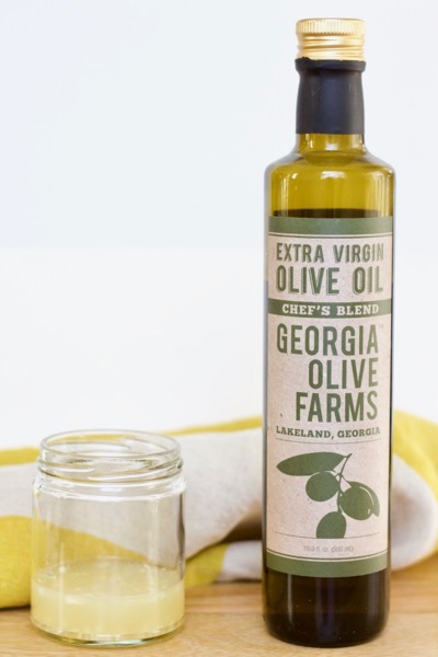 lemon juice and a bottle of olive oil to make easy lemon vinaigrette