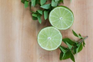sliced lime and basil leaves for pan-seared fish with lime and basil