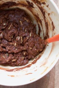 mixed up batter for flourless double chocolate zucchini cake in a mixing bowl